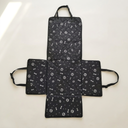 Black bone print waterproof dog car seat cover hammock on a cream background