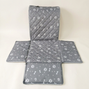 Grey bone print waterproof dog car seat cover hammock on a cream background