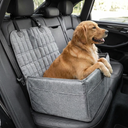 Dog sitting on the hammock car seat cover on a back seat