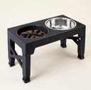 Adjustable elevated dog bowl stand with a steel bowl and a slow-feed bowl on a cream background