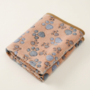 Peach fleece pet blanket with paw print design for cats & dogs, studio photo