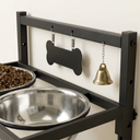 Close-up of the bone tag holder and bell on the wall-mounted dog bowl rack