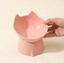 Raised pet bowl shown beside a measuring tape for scale