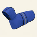 Blue waterproof dog raincoat with hood for small to large dogs, studio photo