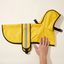 Yellow waterproof dog raincoat with hood for small to large dogs, scale photo