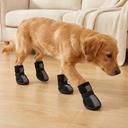 Black breathable mesh dog boots with reflective straps for dogs, lifestyle photo