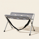 Grey foldable dog and cat grooming hammock on a cream background