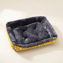 Yellow square pet bed cushion on a cream background