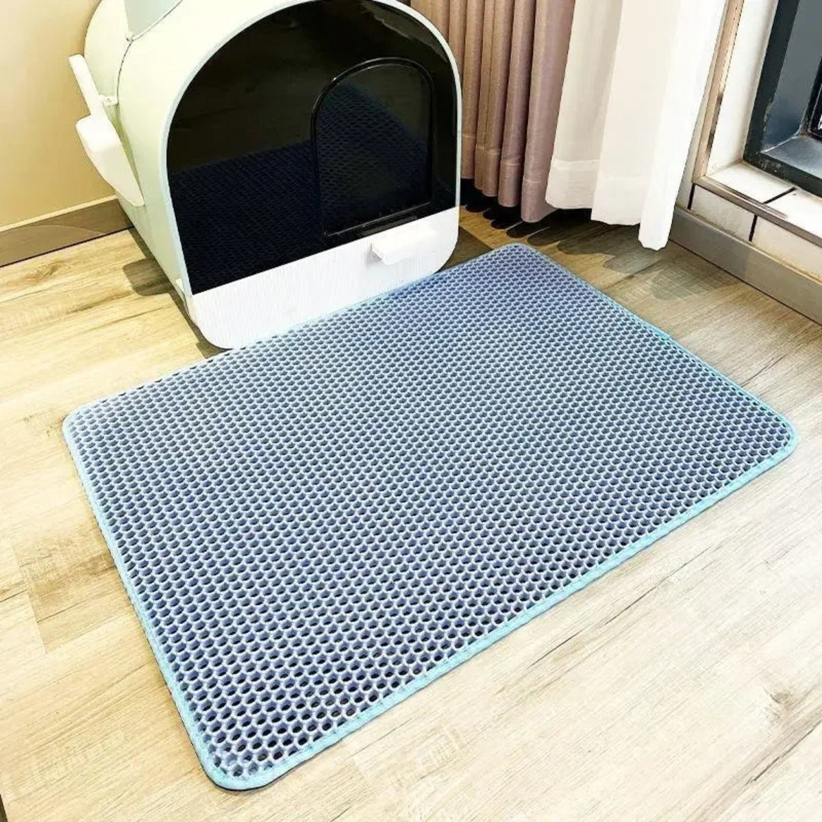 Cat stepping onto the waterproof litter mat — My Petsworth