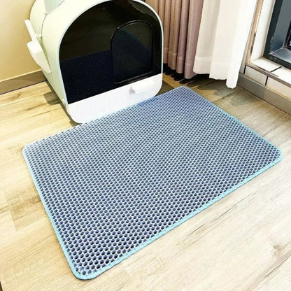 Cat stepping onto the waterproof litter mat — My Petsworth