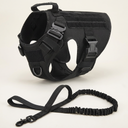 Black tactical dog harness with bungee lead on a cream background