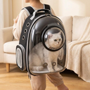 Black pet carrier backpack with bubble window for dogs & cats, lifestyle photo