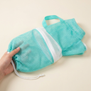 Teal cat bathing bag with adjustable mesh restraint, scale photo