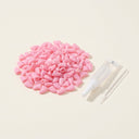Light Pink soft nail caps for cats with adhesive glue, studio photo