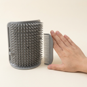 Grey wall-mounted grooming brush & scratcher comb for cats, scale photo