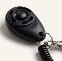 Black dog training clicker with adjustable wrist strap, detail photo