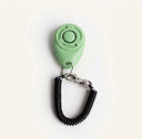 Light Green dog training clicker with adjustable wrist strap, studio photo