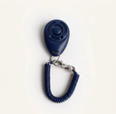 Navy dog training clicker with adjustable wrist strap, studio photo