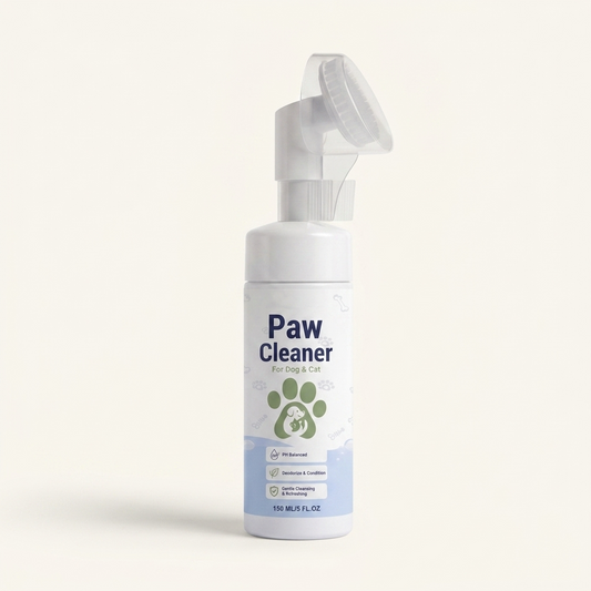 Person applying foam paw cleanser from the bottle to a dog's paw — My Petsworth