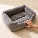 Grey cushioned cat bed for cats, scale photo