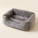 Grey cushioned cat bed for cats, studio photo