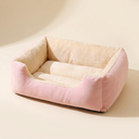 Pink cushioned cat bed for cats, studio photo