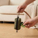 Army Green canvas dog poo bag holder with carabiner clip, lifestyle photo