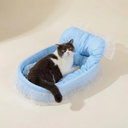 Blue plush oval cat bed with lace trim for small dogs & cats, studio photo