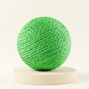 Green sisal scratch ball toy with jingle bell for cats, studio photo