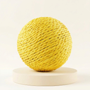 Yellow sisal scratch ball toy with jingle bell for cats, studio photo