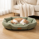Dog resting on the green soft dog bed cushion at home