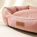 Fabric and stitching detail of the pink soft dog bed cushion