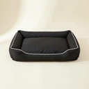 Black waterproof square dog bed on a cream background