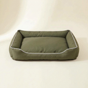 Olive green waterproof square dog bed on a cream background