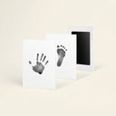 Black inkless paw print keepsake kit on a cream background