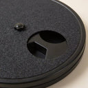 Close-up of the sandpaper surface and snack compartment on the dog nail scratch board