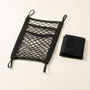 Black elastic mesh car barrier with storage bag for dogs, studio photo