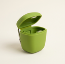 Green silicone training pouch with magnetic lid for dogs, studio photo