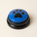 Blue recordable talking dog button on a cream background