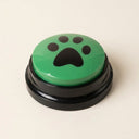 Green recordable talking dog button on a cream background